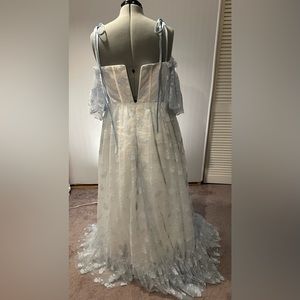 Never worn or altered formal gown. Light blue